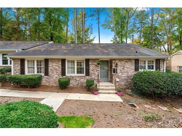 Charming brick home featuring a well-manicured lawn and inviting front entrance at 2404 Northlake Ct, Atlanta, GA 30345