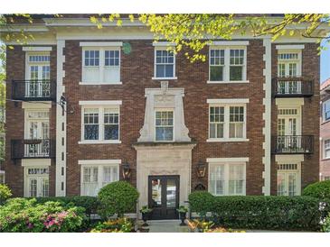 Classic brick apartment building with charming balconies and well-maintained landscaping at 20 Collier Nw Rd # 11, Atlanta, GA 30309