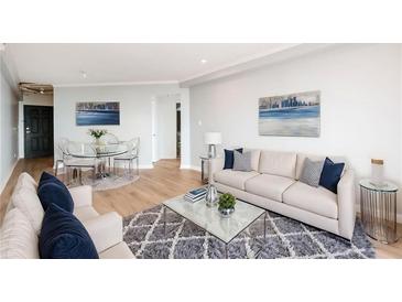 Bright living room with a modern decor featuring comfortable seating, area rug, and stylish furnishings at 1501 Clairmont Rd # 1818, Decatur, GA 30033