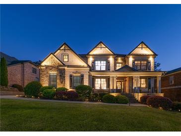 Inviting two-story home featuring manicured landscaping and subtle exterior lighting at 2270 Abbey Cove Ct, Marietta, GA 30062