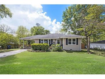 Charming single-story home with a well-maintained front yard and beautiful landscaping at 4061 Newman Ellis Rd, Douglasville, GA 30134