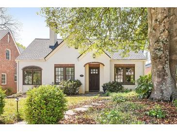 Charming single-story home featuring a manicured front yard and classic architectural details at 2029 Tuxedo Ne Ave, Atlanta, GA 30307