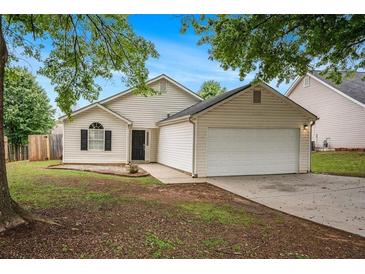 Charming single-story home with a well-manicured front yard and a two-car garage, perfect for a small Gathering at 175 Regency Park Dr, Mcdonough, GA 30253