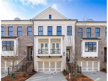 Beautiful brick townhome with two car garage and a lovely second story balcony at 255 Briscoe Way # 5, Alpharetta, GA 30009