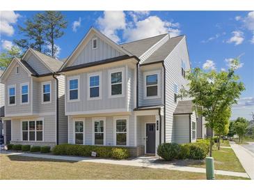 Charming two-story home with classic design, beautiful windows and lush landscaping at 787 Belrose Dr, Smyrna, GA 30080