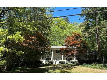 Traditional two-story home featuring classic white columns and mature landscaping at 2985 Duke Of Gloucester, Atlanta, GA 30344