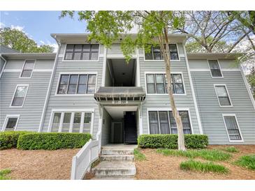 Three-story building with well-manicured landscaping and inviting entryway at 211 Summit North Drive Ne, Atlanta, GA 30324
