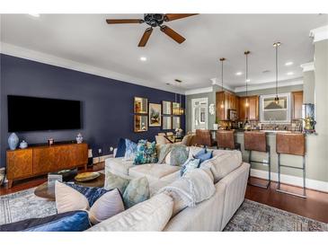 Inviting living room featuring a comfortable sectional sofa, hardwood floors, and stylish decor at 700 Piedmont Ne Ave # 4, Atlanta, GA 30308