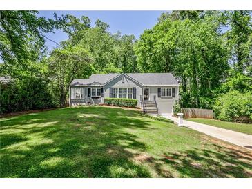 Charming home featuring a well-maintained lawn, lovely landscaping, and a welcoming entrance at 1362 Briarcliff Ne Rd, Atlanta, GA 30306