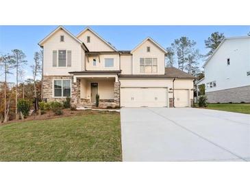 Charming two-story home featuring a three-car garage and stone accents at 2340 Ellis Mountain Dr, Marietta, GA 30064
