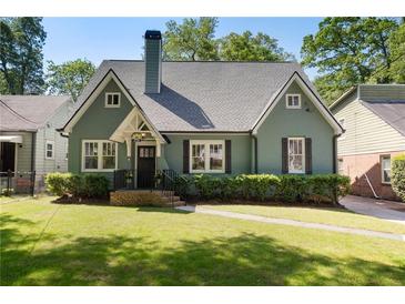 Charming green bungalow with a symmetrical design and well-manicured lawn at 2759 Arbor Se Ave, Atlanta, GA 30317
