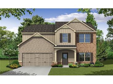 Charming two-story home featuring a mix of brick and siding with a covered front porch and attached two-car garage at 484 Charleston Pl, Villa Rica, GA 30180