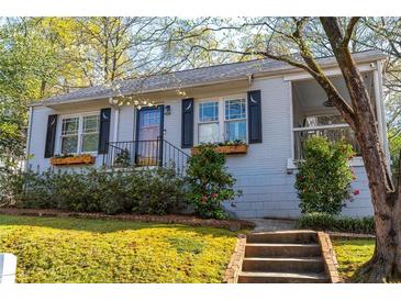 Charming bungalow with gray painted brick, a landscaped front yard, and inviting curb appeal at 1763 Delaware Ne Ave, Atlanta, GA 30307