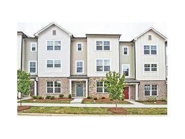Charming townhomes with brick accents, neutral siding, and well-manicured landscaping at 1608 Falcon Crest Way # 58, Decatur, GA 30032
