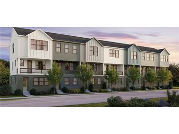 Charming row of new construction townhomes featuring modern farmhouse architecture and lush landscaping at 434 Argosy Park Cir # 13, Alpharetta, GA 30005