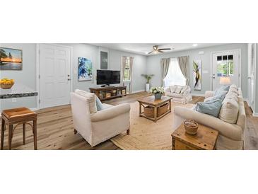 Bright living room with a ceiling fan, modern furnishings, and stylish decor accents at 3917 Dallas Acworth Nw Hwy, Acworth, GA 30101