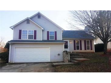 Charming two-story home featuring a 2 car garage and a welcoming front entrance at 3311 Basking Shade Ln, Decatur, GA 30034