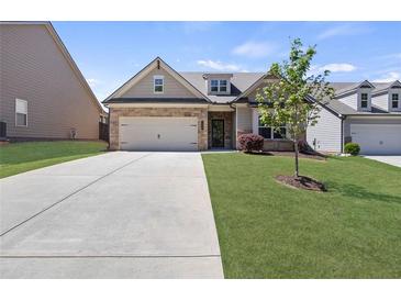 Charming single-Gathering home with a two-car garage and well-manicured lawn in a suburban neighborhood at 238 Dorothy Ln, Lawrenceville, GA 30046