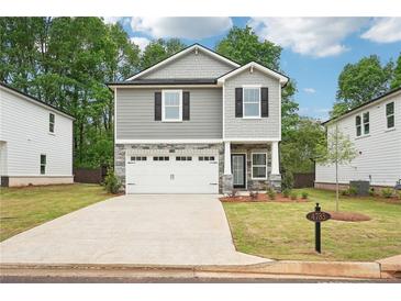 Charming two-story home with a manicured front yard and inviting curb appeal in a neighborhood at 4785 Marjorie Dr, Cumming, GA 30041