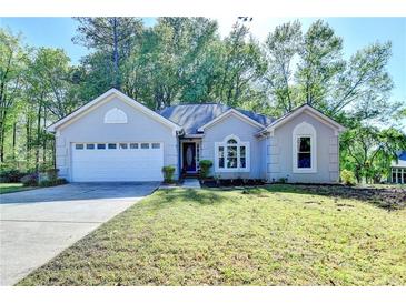 Charming one-story home with a two car garage and well-maintained landscaping at 4640 Lambton Cir, Suwanee, GA 30024