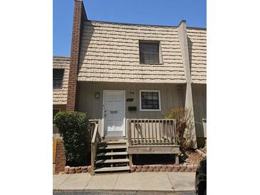 Charming two-story home with a cozy front porch and a well-maintained exterior at 6433 Stone Way, Morrow, GA 30260