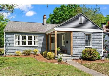 Charming home featuring classic architecture, a cozy porch, and a well-maintained front yard at 756 Ormewood Se Ave, Atlanta, GA 30312