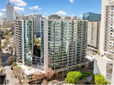 Luxury high rise condo building in the city with glass windows and surrounding skyline views at 44 Peachtree Nw Pl # 528, Atlanta, GA 30309