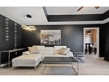 Modern living room features stylish furniture, unique light fixture, and elegant decor at 195 14Th St # 1403, Atlanta, GA 30309