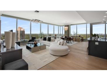 Bright living room featuring floor-to-ceiling windows and open floor plan at 3630 Peachtree Ne Rd # 3207, Atlanta, GA 30326