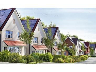 Row of energy-efficient homes featuring solar panels and manicured landscaping, showing a sustainable community design at 155 Alcovy Ter, Alpharetta, GA 30009