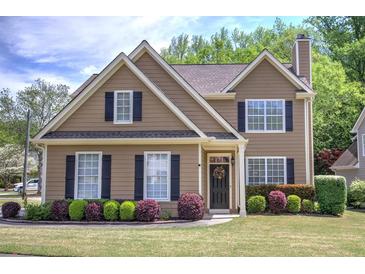 Charming two-story home with well-manicured lawn and mature landscaping at 2186 Mainsail Dr, Marietta, GA 30062