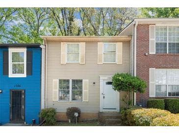 Charming townhouse featuring a well-maintained front yard and classic architecture at 1784 Timber Valley Se Way, Smyrna, GA 30080