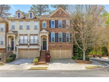 Charming brick townhome with attached garage and manicured landscaping in a desirable neighborhood at 2827 Overlook Ne Trce, Atlanta, GA 30324