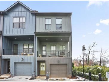 Charming townhome with a modern design, covered balconies, and an attached garage at 200 Chestnut Cir, Atlanta, GA 30342