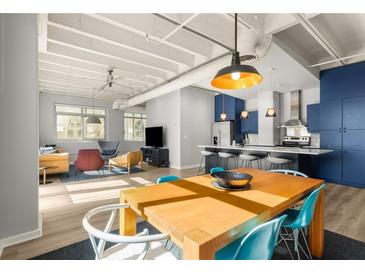 Bright open concept living room and kitchen with hardwood floors and modern decor at 805 Peachtree Ne St # 220, Atlanta, GA 30308