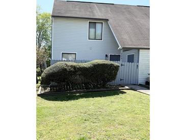 Charming two-story home features a well-maintained lawn and attractive landscaping at 296 Country Club Dr, Jonesboro, GA 30238
