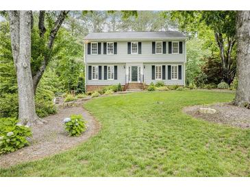 Charming two-story home with well-maintained lawn and mature trees at 3320 Woodleaf Way, Marietta, GA 30062