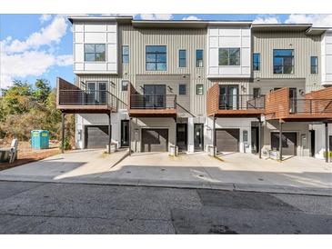 Modern townhome featuring individual balconies and garages, set in a contemporary design at 2333 Mason Dr # D26, Atlanta, GA 30316