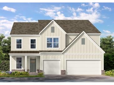 Charming two-story home with a two-car garage and traditional architectural details at 122 Parkview Dr, Dallas, GA 30157