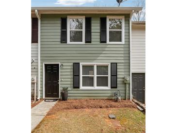 Charming townhouse with green siding, black shutters, and well-maintained front yard at 4282 Worth Nw St, Acworth, GA 30101