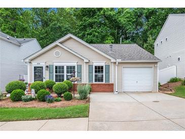 Charming single-story home with well-manicured landscaping, a one car garage, and neutral toned siding at 624 Spanish Oak Dr, Acworth, GA 30102