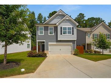 Charming two-story home with a well-manicured lawn and a two-car garage at 458 Burgundy Se Ter, Atlanta, GA 30354