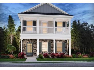 Charming two-story home with stone accents, a covered porch, and a second-story balcony at 1270 Firefly Field Trce, Lawrenceville, GA 30045