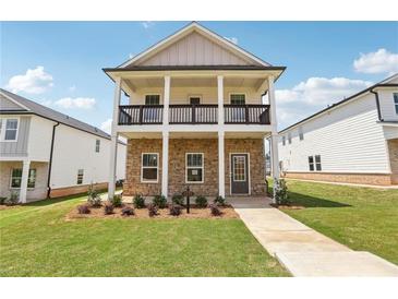Charming two-story home featuring a welcoming front porch and well-maintained landscaping at 1270 Firefly Field Trce, Lawrenceville, GA 30045