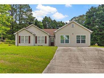 Charming single-story home with well-maintained lawn and a concrete driveway at 1230 Brook Meadow Ct, Lawrenceville, GA 30045