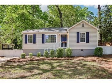 Charming home showcasing curb appeal, mature landscaping, and a well-maintained front yard at 3417 Glen Rd, Decatur, GA 30032