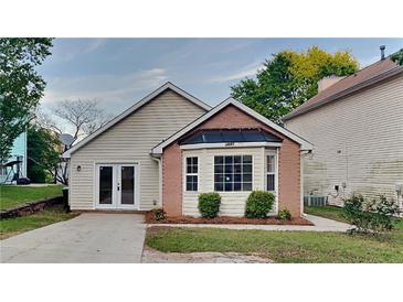 Charming single-story home featuring a bay window, brick accents, and a well-manicured lawn at 3640 Sapphire Ct, Decatur, GA 30034