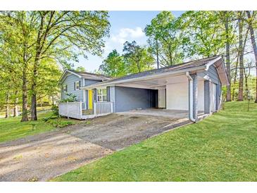 Charming two-story home with covered parking and a welcoming front porch at 3839 Rosedale Ln, Douglasville, GA 30135