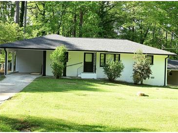 Charming renovated single-story home featuring a carport and freshly manicured lawn at 110 Ridge Se Ct, Mableton, GA 30126