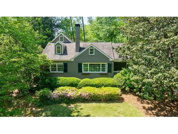 Charming home surrounded by lush greenery, showcasing its classic architecture and manicured landscaping at 728 Wesley Nw Dr, Atlanta, GA 30305